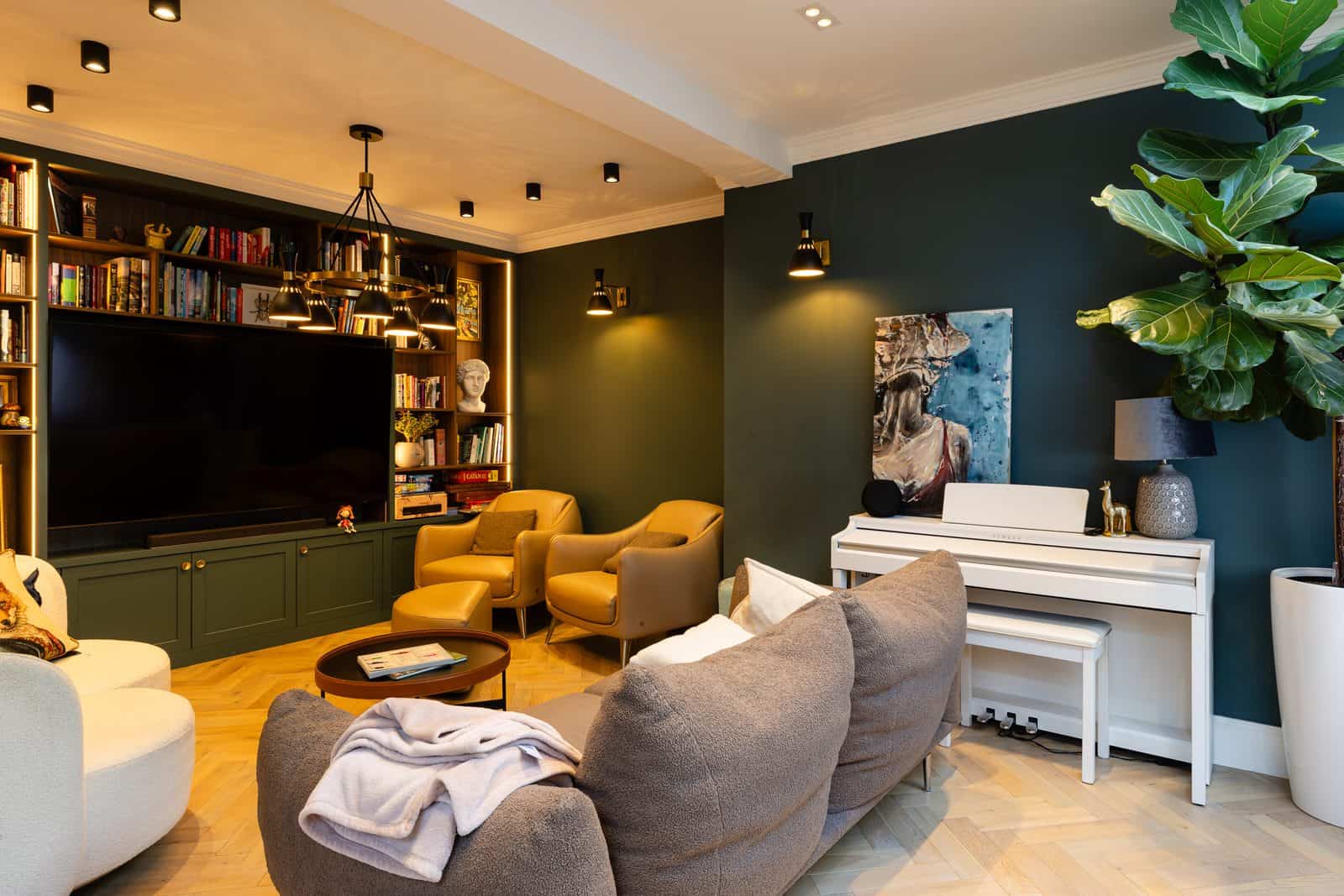 Stylish dark green living room with home cinema and piano — Airbnb photography in London